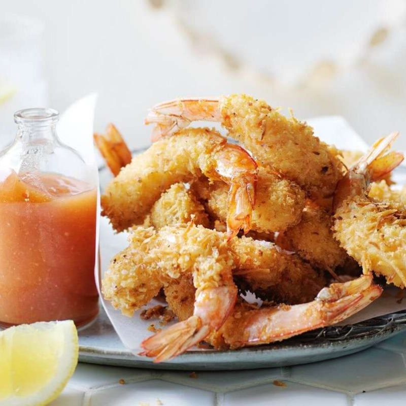 seafood holiday party recipes: Deep fried coconut prawns with papaya dressing
